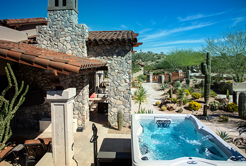 Desert view of a swim spa backyard installation